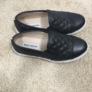 Black leather quilted slip ons